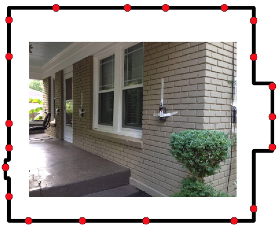 Radio sensors attached to the outside of the front of a tan brick house